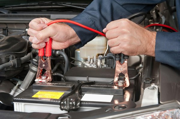 What steps should you follow to replace a hybrid vehicle's battery safely in the UK?